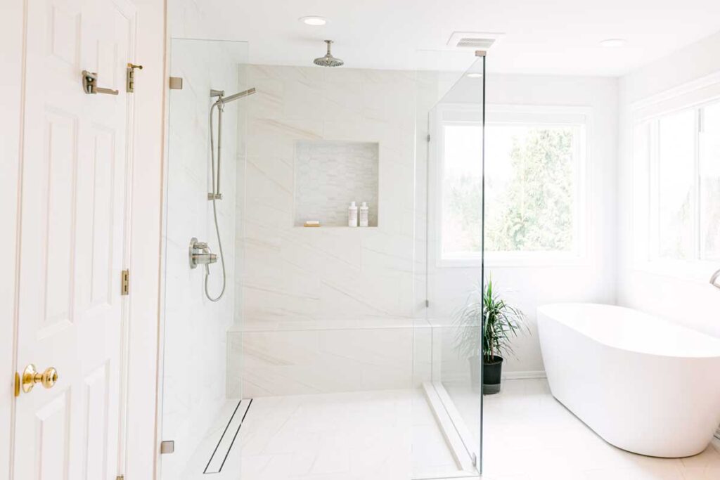 Bathroom remodel with tiled walk-in shower and custom vanity