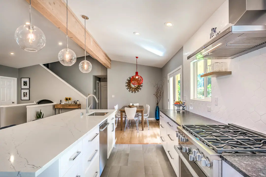Bright open-flow kitchen with glass pendant lighting