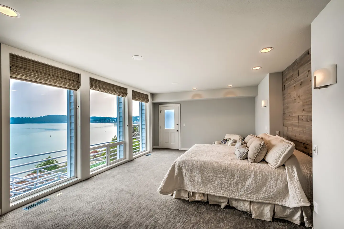 Master bedroom with floor-to-ceiling wood-wrapped windows